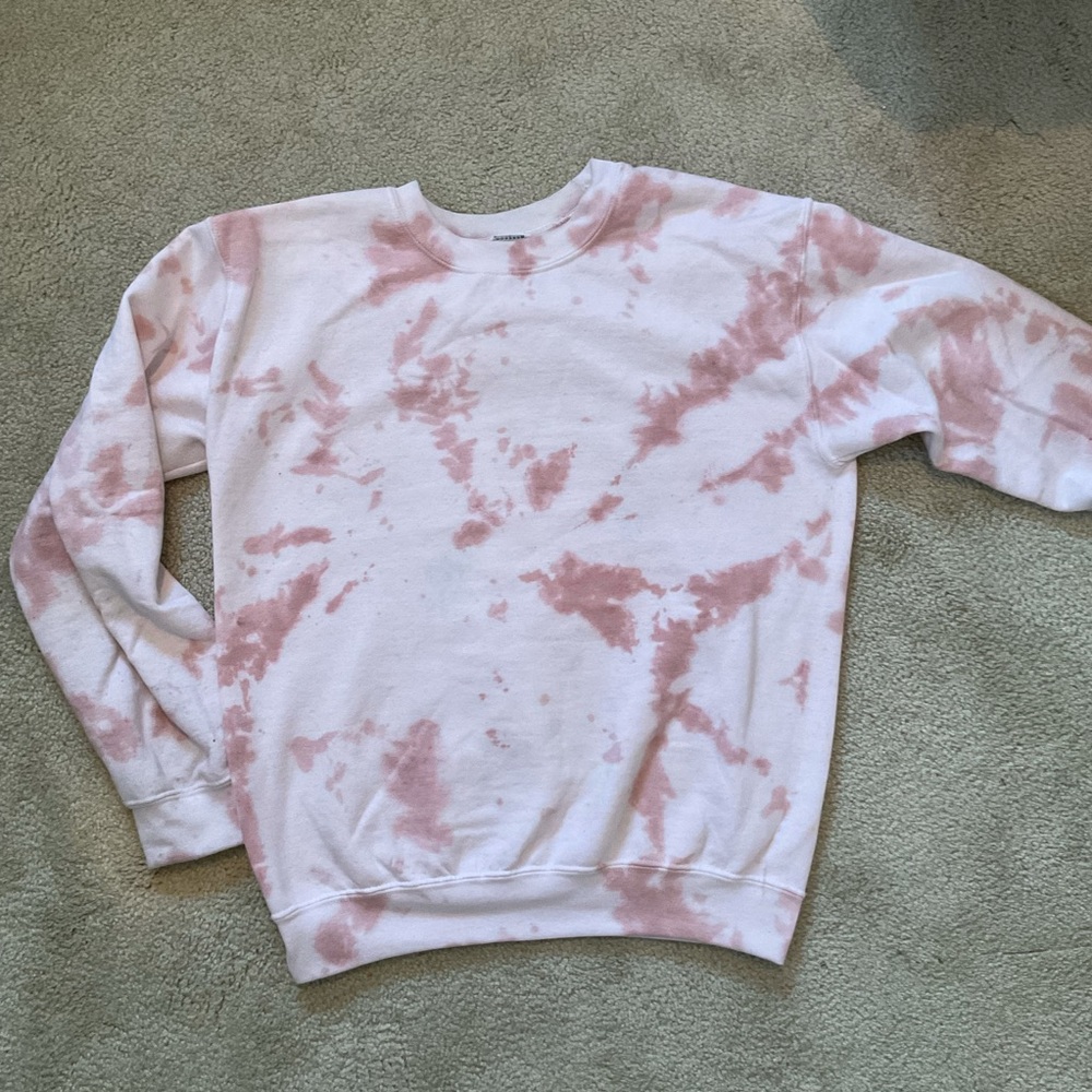 Baby pink tie dye crew neck size S with a splash of blue in the front